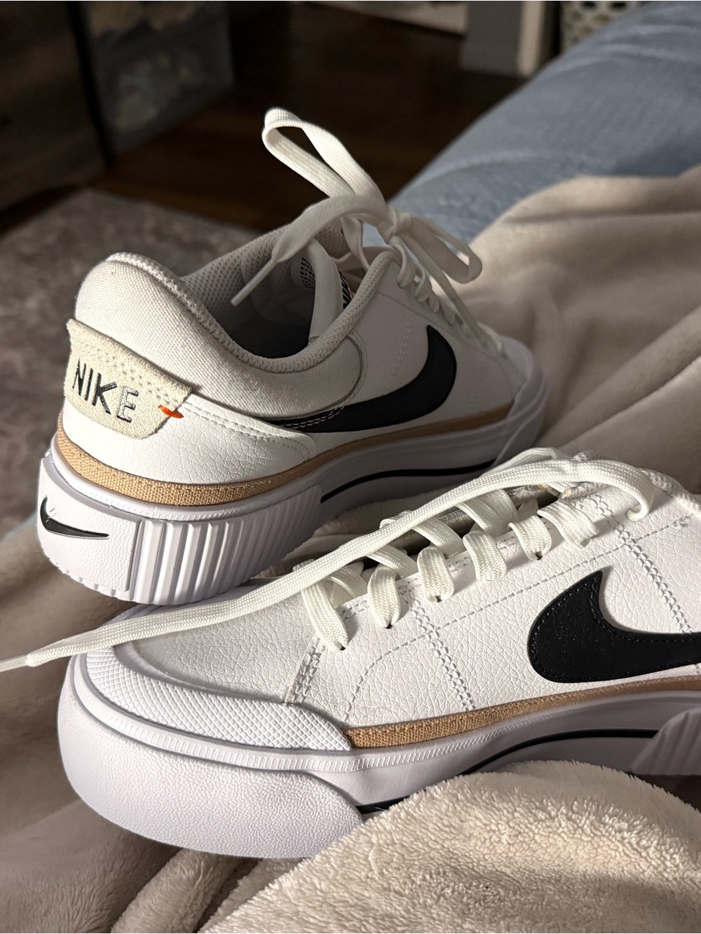 Nike Women's White Sneakers with Black Swoosh and Tan Trim
